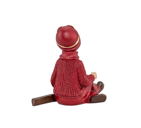 Main Image Boy with skis, sitting